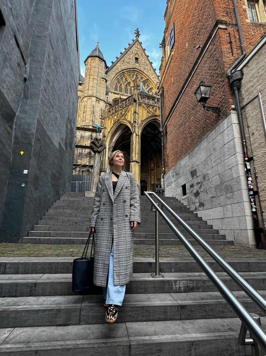 woman on the stairs of church in Nijmegen